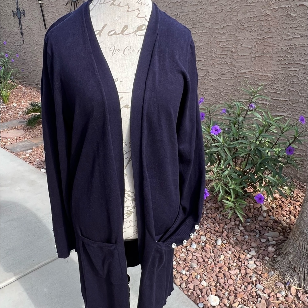 Blue long sleeved knee length knit sweater.